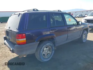 1997 Jeep Grand Cherokee Laredo z VIN 1J4GZ58Y2VC551199, wystawiony jako IAAI lot #42625502 z przebiegiem 210 722 mil mil oraz . Historia ofert i sprzedaży dostępna na DreamBid. Obrazek 4.