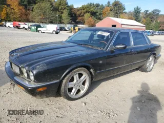 1998 Jaguar XJ with VIN SAJPX1840WC816044, listed as a Copart auction lot 76802374 with 99,149 mi miles and Clean title. Bid and sale history available at DreamBid. Image 1.