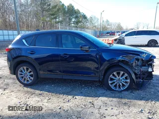 2021 Mazda CX-5 Grand Touring with VIN JM3KFADM5M0428279, listed as a IAAI auction lot 41747175 with 49,579 mi miles. Bid and sale history available at carsss.com. Image 14.