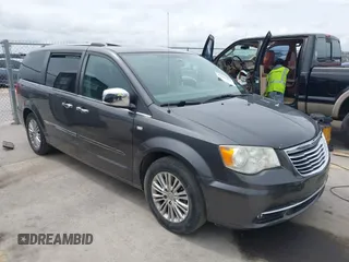 2014 Chrysler Town & Country Touring-L with VIN 2C4RC1CG7ER300693, listed as a IAAI auction lot 41849463 with 174,203 mi miles. Bid and sale history available at carsss.com. Image 1.