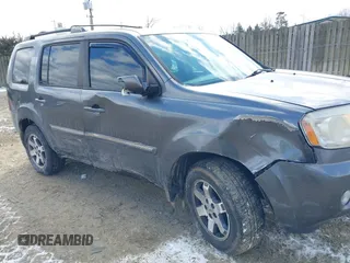 2011 Honda Pilot Touring with VIN 5FNYF4H98BB016012, listed as a IAAI auction lot 41634844 with 202,160 mi miles. Bid and sale history available at carsss.com. Image 6.