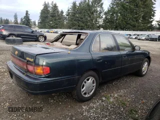 1994 Toyota Camry XLE with VIN JT2GK13E2R0008225, listed as a Copart auction lot 83668084 with 258,735 mi miles and Salvage Title. Bid and sale history available at carsss.com. Image 3.