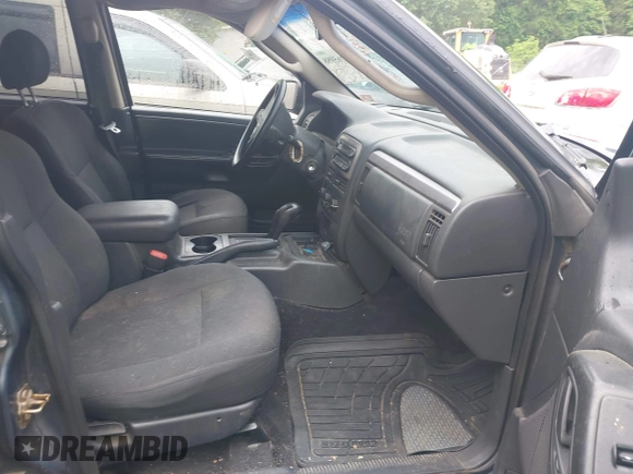 2004 Jeep Grand Cherokee Laredo z VIN 1J4GW48S64C152101, wystawiony jako IAAI lot #42165988 z przebiegiem 244 247 mil mil oraz . Historia ofert i sprzedaży dostępna na DreamBid. Obrazek 5.