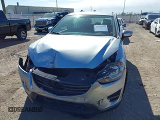 2016 Mazda CX-5 Sport with VIN JM3KE2BE9G0915168, listed as a IAAI auction lot 41482749 with 86,802 mi miles and . Bid and sale history available at carsss.com. Image 6.