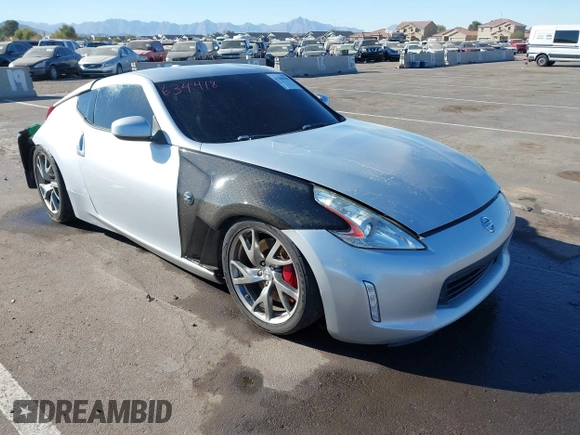 2014 Nissan 370Z Nismo with VIN JN1AZ4EHXEM634418, listed as a IAAI auction lot 41308580 with 84,074 mi miles and . Bid and sale history available at DreamBid. Image 1.