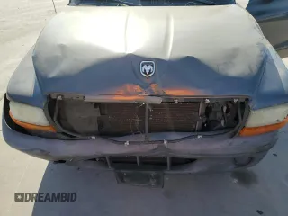 2003 Dodge Dakota with VIN 1D7FL16X13S189963, listed as a Copart auction lot 77114344 with 100,127 mi miles and Salvage Title. Bid and sale history available at carsss.com. Image 11.