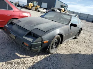 1986 Nissan 300ZX z VIN JN1HZ14S6GX157854, wystawiony jako Copart lot #75675514 z przebiegiem 190 051 mil mil oraz Czysty tytuł • Clean title. Historia ofert i sprzedaży dostępna na DreamBid. Obrazek 1.