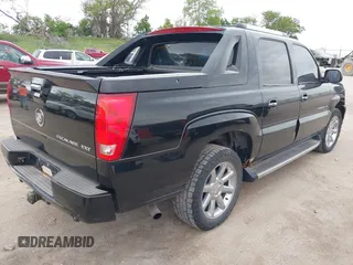 2003 Cadillac Escalade EXT z VIN 3GYEK63N23G315533, wystawiony jako IAAI lot #42354561 z przebiegiem 172 155 mil mil oraz . Historia ofert i sprzedaży dostępna na DreamBid. Obrazek 4.