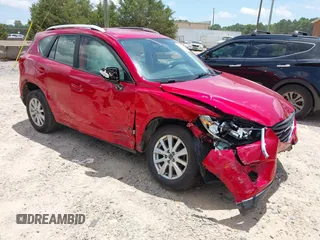 2016 Mazda CX-5 Sport z VIN JM3KE2BY3G0879598, wystawiony jako IAAI lot #42557760 z przebiegiem 152 128 mil mil oraz . Historia ofert i sprzedaży dostępna na DreamBid. Obrazek 1.