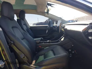 2020 Tesla Model 3 Standard Range Plus with VIN 5YJ3E1EAXLF614002, listed as a IAAI auction lot 41758898 with 42,363 mi miles and . Bid and sale history available at DreamBid. Image 5.
