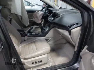 2016 Ford Escape Titanium with VIN 1FMCU9J90GUB35593, listed as a IAAI auction lot 42309020 with 173,019 mi miles and . Bid and sale history available at DreamBid. Image 5.
