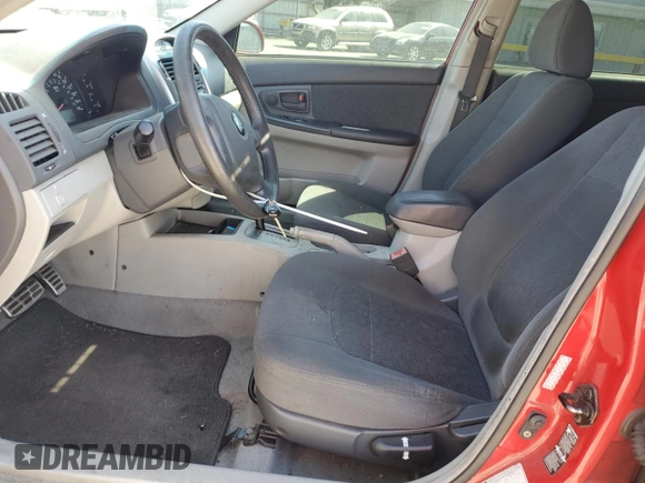 2005 Kia Spectra with VIN KNAFE162455069422, listed as a Copart auction lot 52999455 with 249,774 mi miles and Salvage Title. Bid and sale history available at carsss.com. Image 7.