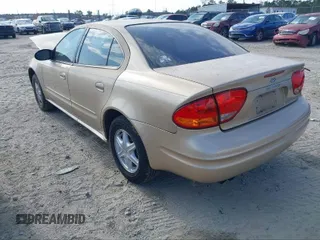 2004 Oldsmobile Alero GL1 z VIN 1G3NL52F14C137772, wystawiony jako IAAI lot #41850374 z przebiegiem 216 956 mil mil oraz . Historia ofert i sprzedaży dostępna na DreamBid. Obrazek 3.