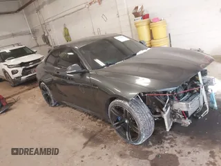 2017 BMW M2 with VIN WBS1H9C36HV888803, listed as a IAAI auction lot 41592938 with 71,762 mi miles. Bid and sale history available at carsss.com. Image 1.