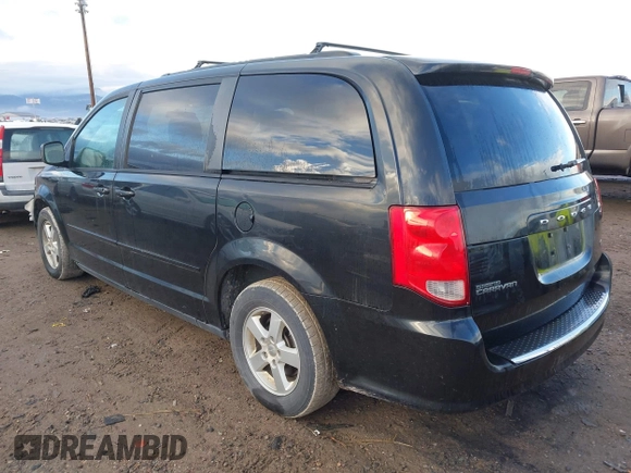 2012 Dodge Grand Caravan SXT with VIN 2C4RDGCG3CR318900, listed as a IAAI auction lot 41145958 with 201,117 mi miles and . Bid and sale history available at DreamBid. Image 3.