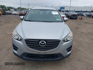 2016 Mazda CX-5 Sport z VIN JM3KE4BY1G0711602, wystawiony jako IAAI lot #42537627 z przebiegiem Nie podano mil oraz . Historia ofert i sprzedaży dostępna na DreamBid. Obrazek 12.