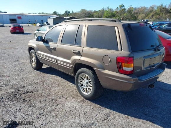 2002 Jeep Grand Cherokee Limited with VIN 1J8GW58N12C268589, listed as a IAAI auction lot 41748099 with 146,673 mi miles. Bid and sale history available at carsss.com. Image 3.