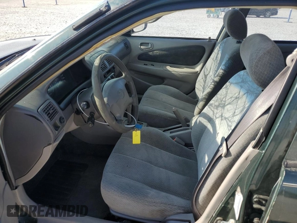 2000 Toyota Corolla VE with VIN 1NXBR12E5YZ387383, listed as a Copart auction lot 78931374 with 162,008 mi miles and Salvage title. Bid and sale history available at DreamBid. Image 7.