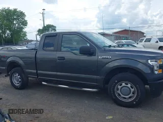 2015 Ford F-150 XLT with VIN 1FTEX1E89FKD84587, listed as a IAAI auction lot 42102545 with 141,265 mi miles. Bid and sale history available at carsss.com. Image 13.