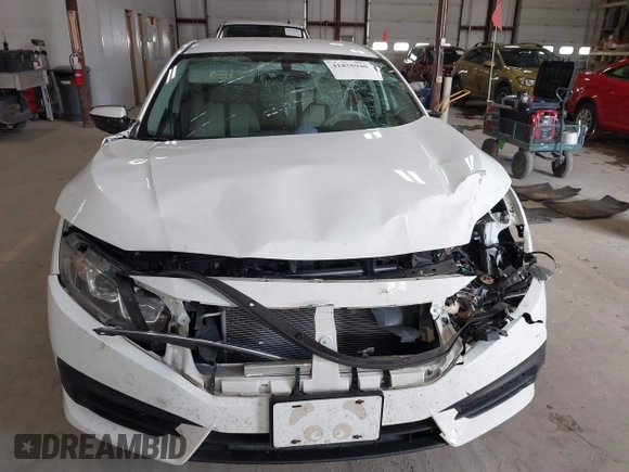 2016 Honda Civic Sedan LX with VIN 19XFC2F59GE028056, listed as a IAAI auction lot 41875940 with 124,243 mi miles. Bid and sale history available at carsss.com. Image 12.