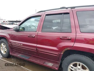 1999 Jeep Grand Cherokee Limited with VIN 1J4GW68N5XC642670, listed as a IAAI auction lot 41990199 with 154,492 mi miles. Bid and sale history available at carsss.com. Image 15.