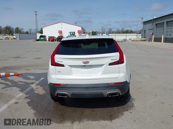 2020 Cadillac XT4 AWD Premium Luxury z VIN 1GYFZDR44LF036461, wystawiony jako IAAI lot #41934371 z przebiegiem 90 545 mil mil oraz . Historia ofert i sprzedaży dostępna na DreamBid. Obrazek 16.