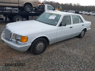 1989 Mercedes-Benz 420 Series 420SEL with VIN WDBCA35E4KA456613, listed as a IAAI auction lot 41145650 with 199,599 mi miles. Bid and sale history available at carsss.com. Image 2.