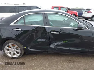 2014 Cadillac ATS Luxury AWD z VIN 1G6AH5SX0E0196052, wystawiony jako IAAI lot #41995886 z przebiegiem 97 531 mil mil oraz . Historia ofert i sprzedaży dostępna na DreamBid. Obrazek 6.