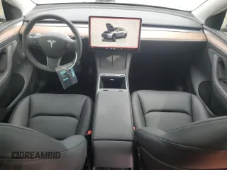 2025 Tesla Model Y Long Range with VIN 7SAYGDED7SF227582, listed as a Copart auction lot 47556595 with 5,340 mi miles and Salvage Title. Bid and sale history available at DreamBid. Image 8.
