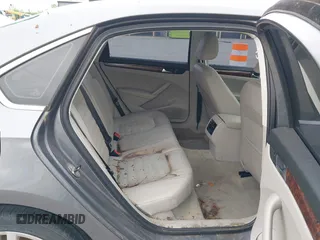 2013 Volkswagen Passat SEL Premium z VIN 1VWCN7A39DC058142, wystawiony jako IAAI lot #42369150 z przebiegiem 127 302 mil mil oraz . Historia ofert i sprzedaży dostępna na DreamBid. Obrazek 8.