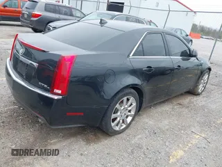 2009 Cadillac CTS AWD w/1SA with VIN 1G6DG577890126877, listed as a IAAI auction lot 42063927 with 117,444 mi miles. Bid and sale history available at carsss.com. Image 4.