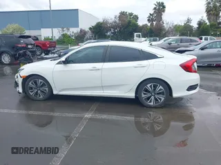 2017 Honda Civic EX-L z VIN 2HGFC1F79HH635156, wystawiony jako IAAI lot #41922115 z przebiegiem 142 565 mil mil oraz . Historia ofert i sprzedaży dostępna na DreamBid. Obrazek 14.