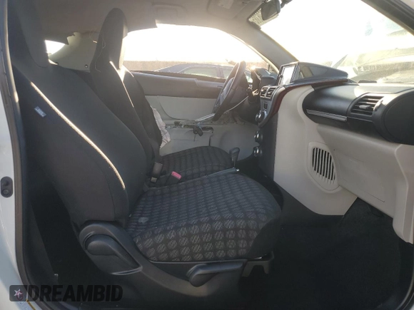 2014 Scion iQ with VIN JTNJJXB01EJ026837, listed as a Copart auction lot 43596385 with 52,826 mi miles and Salvage title. Bid and sale history available at DreamBid. Image 7.