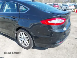 2014 Ford Fusion SE with VIN 1FA6P0HDXE5370384, listed as a IAAI auction lot 41973412 with 147,459 mi miles and . Bid and sale history available at DreamBid. Image 6.