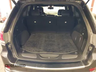 2015 Jeep Grand Cherokee Summit with VIN 1C4RJFJG4FC634129, listed as a IAAI auction lot 42481877 with 149,087 mi miles and . Bid and sale history available at DreamBid. Image 18.