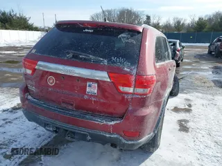 2013 Jeep Grand Cherokee Laredo with VIN 1C4RJFAG4DC572986, listed as a IAAI auction lot 41586820 with 100,899 mi miles. Bid and sale history available at carsss.com. Image 4.