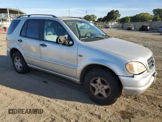 2000 Mercedes-Benz M-Class with VIN 4JGAB54E6YA181947, listed as a Copart auction lot 77781524 with 165,399 mi miles and Salvage Title. Bid and sale history available at carsss.com. Image 4.