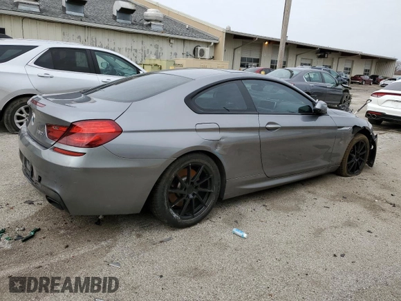 2013 BMW 6 Series 650i xDrive z VIN WBAYM1C53DDZ02397, wystawiony jako Copart lot #48872655 z przebiegiem Nie podano mil oraz Szkoda całkowita • Salvage title. Historia ofert i sprzedaży dostępna na DreamBid. Obrazek 3.
