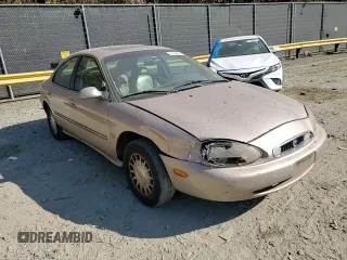 1999 Mercury Sable LS z VIN 1MEFM53S7XG602788, wystawiony jako Copart lot #76894294 z przebiegiem 186 315 mil mil oraz Szkoda całkowita • Salvage title. Historia ofert i sprzedaży dostępna na DreamBid. Obrazek 10.