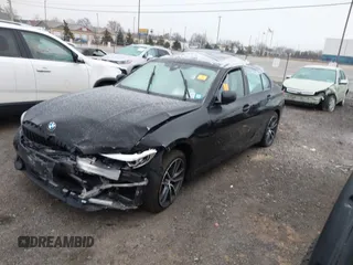 2020 BMW 3 Series 330i xDrive with VIN WBA5R7C08LFH44012, listed as a IAAI auction lot 41252675 with 57,486 mi miles. Bid and sale history available at carsss.com. Image 2.
