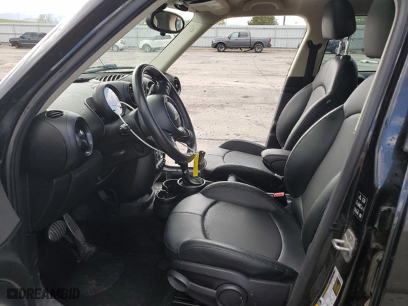 2016 MINI Cooper Countryman S with VIN WMWZC5C50GWU03080, listed as a Copart auction lot 52864144 with 70,949 mi miles and Salvage Title. Bid and sale history available at carsss.com. Image 7.