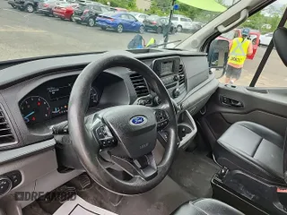 2020 Ford Transit Cargo z VIN 1FTYE1C89LKA17335, wystawiony jako IAAI lot #42561511 z przebiegiem 276 728 mil mil oraz . Historia ofert i sprzedaży dostępna na DreamBid. Obrazek 26.