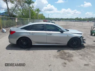 2022 Honda Civic Sport z VIN 2HGFE2F58NH586977, wystawiony jako IAAI lot #42202088 z przebiegiem 56 060 mil mil oraz . Historia ofert i sprzedaży dostępna na DreamBid. Obrazek 13.