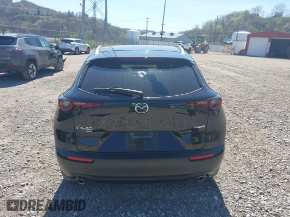 2023 Mazda CX-30 S Carbon Edition with VIN 3MVDMBCM1PM509987, listed as a IAAI auction lot 42060833 with 14,140 mi miles and . Bid and sale history available at DreamBid. Image 16.