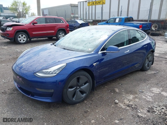 2019 Tesla Model 3 Long Range with VIN 5YJ3E1EB5KF497582, listed as a IAAI auction lot 42019402 with 118,113 mi miles. Bid and sale history available at carsss.com. Image 23.