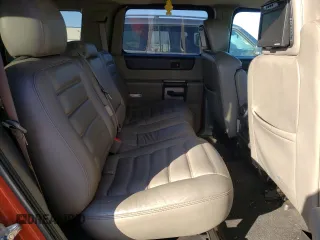 2004 Hummer H2 with VIN 5GRGN23U24H101928, listed as a Copart auction lot 86820104 with 197,079 mi miles and Salvage Title. Bid and sale history available at carsss.com. Image 10.