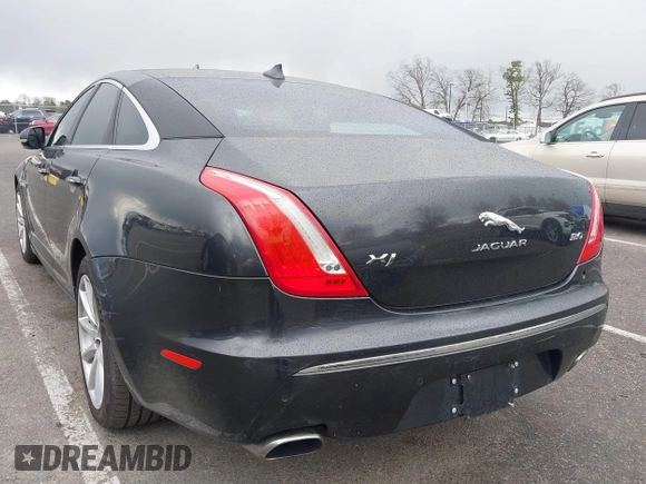 2014 Jaguar XJ with VIN SAJWA1CZ0E8V73966, listed as a IAAI auction lot 41887234 with 120,804 mi miles and . Bid and sale history available at DreamBid. Image 3.