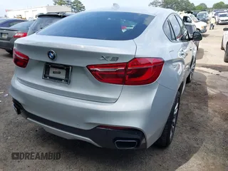 2016 BMW X6 xDrive50i z VIN 5UXKU6C57G0R33572, wystawiony jako IAAI lot #42103956 z przebiegiem 65 520 mil mil oraz . Historia ofert i sprzedaży dostępna na DreamBid. Obrazek 4.