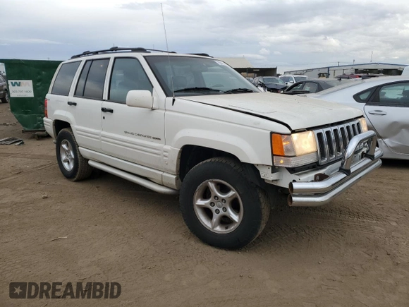 1998 Jeep Grand Cherokee Limited with VIN 1J4GZ88Z4WC164505, listed as a Copart auction lot 76843304 with 0 mi miles and Salvage Title. Bid and sale history available at carsss.com. Image 4.