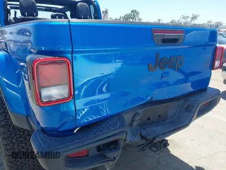 2022 Jeep Gladiator Texas Trail with VIN 1C6HJTAG4NL135346, listed as a IAAI auction lot 42824733 with 40,126 mi miles and . Bid and sale history available at DreamBid. Image 6.